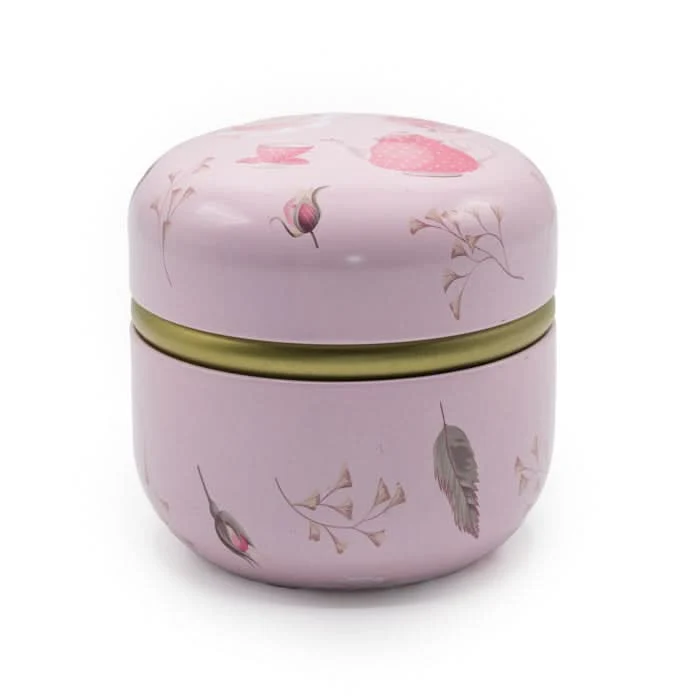 Roze theeblikje met rozen en theepotje